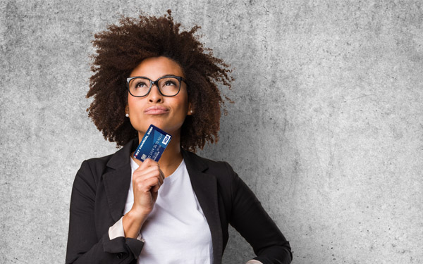 Woman holding Credit Card Image